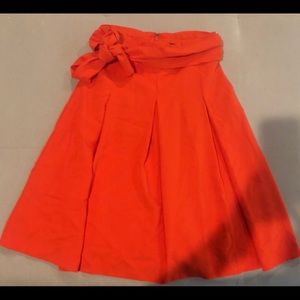 Orange, swing skirt with wrap.